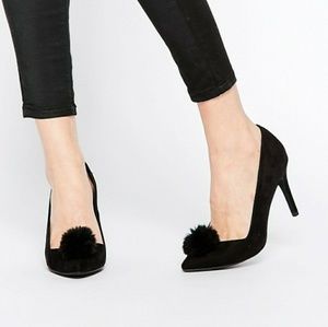 Black suede pumps with fur pom pom